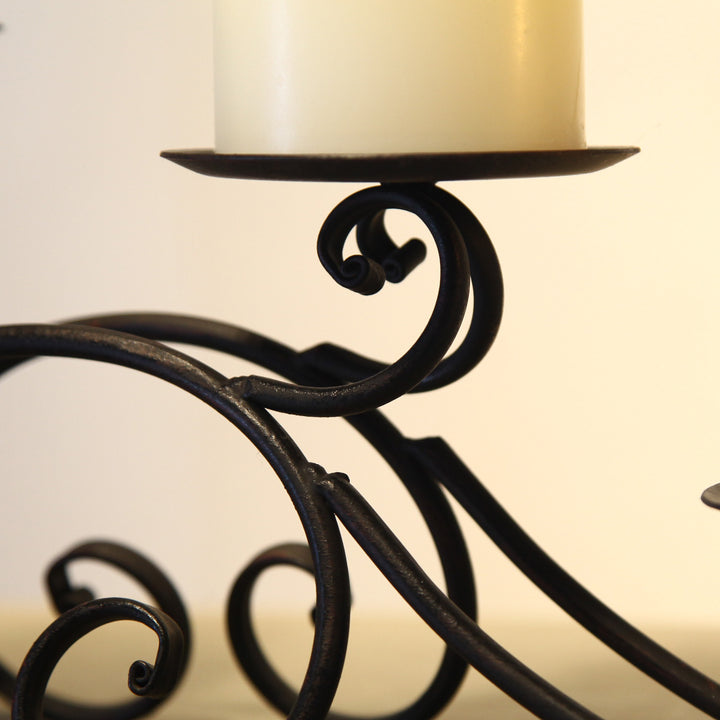 Iron tealight candle holder decor with 5 pillars.