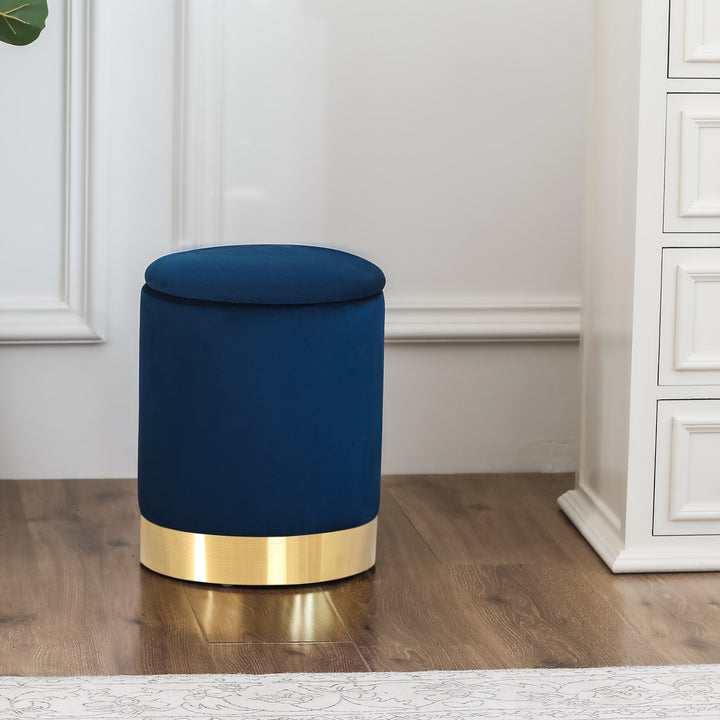 Round velvet storage ottoman with gold base, padded footrest.
